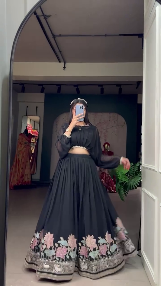 A touch of embroidery and a dash of grace, this elegant georgette co-ord set features a stitched lehenga and a plain top adorned with a delicate lace border—timelessly beautiful